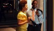 African American couple window shopping