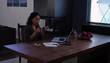 African American woman at home working with laptop