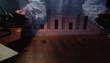 Pan up to businessman analyzing transparency graph in office