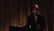 Businesswoman speaking at lectern to audience