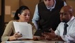 Business people looking at digital tablet together