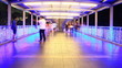 People walking on skywalk at night , time lapse