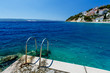Metal Ladder on the Beach and Azure Mediterranean Sea near Split