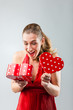Woman opening the gift and is happy