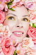 Photo: beautiful woman's face, surrounded by flowers beautiful woman's face, surrounded by flowers