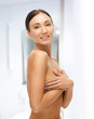 beautiful woman holding her breast