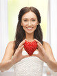 woman showing heart shape