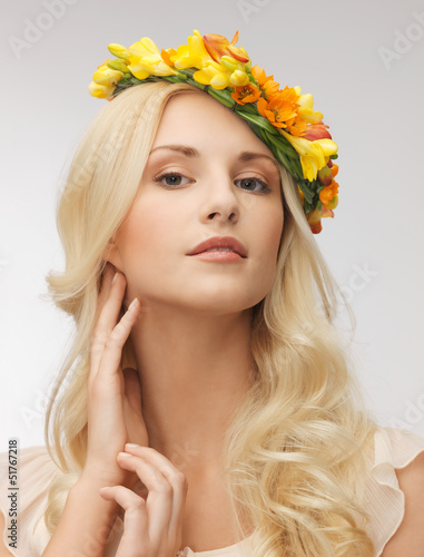 Photo: woman wearing wreath of flowers woman wearing wreath of flowers