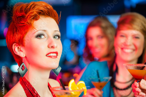 Photo: People in club or bar drinking cocktails People in club or bar drinking cocktails