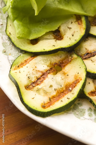 Photo: Grilled organic zucchini slices with herbs and spices Grilled organic zucchini slices with herbs and spices