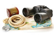 Black modern binoculars with map of adventure isolated on white