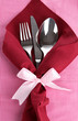Fork,spoon,knife and napkin on bright background