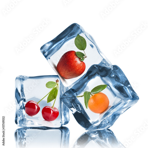 Photo: fruits in ice cubes isolated on white fruits in ice cubes isolated on white