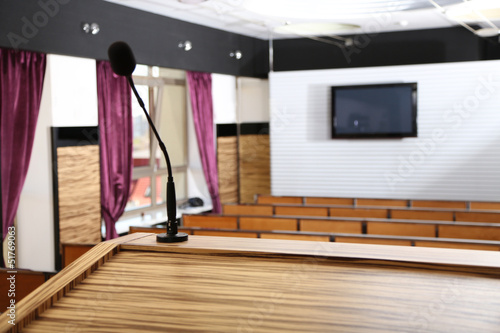 Photo: Interior of empty conference room with tribune Interior of empty conference room with tribune