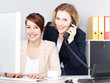 Two business women work in the office