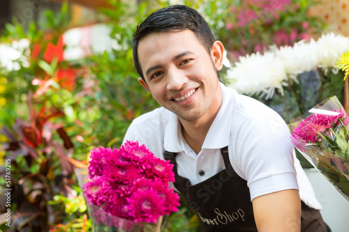 Photo: Florist holding a Bouquet Florist holding a Bouquet