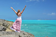 Girl on the rock looking to Atlantic. Little Exuma, Bahamas