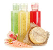 Bottles with scrub and hand-made soap, isolated on white