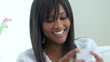 Smiling African American woman on mobile phone