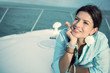 Thoughtful woman in a yacht