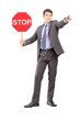 Full length portrait of a man in suit holding a stop sign