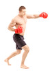 Full length portrait of an athlete with boxing gloves