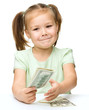 Little girl is counting dollars