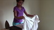 Young Woman ironing Blouse