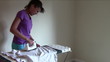 Young Woman ironing Blouse