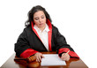 Foto: Female judge taking notes isolated on white Female judge taking notes isolated on white