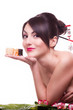 Young beautiful woman with Japanese sushi roll, isolated