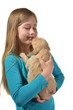 Girl holding a golden retriever pup