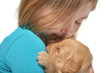 Girl holding a golden retriever pup