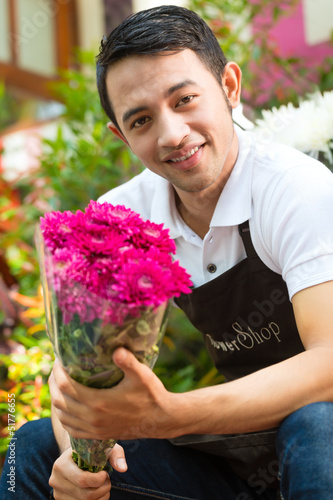 Photo: Florist holding a Bouquet Florist holding a Bouquet