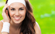 Photo: Young woman in fitness wear, outdoors Young woman in fitness wear, outdoors