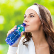 Photo: Woman drinking water, outdoors Woman drinking water, outdoors