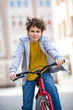 Photo: Urban biking - teenage boy and bike in city Urban biking - teenage boy and bike in city