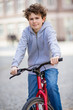 Urban biking - teenage boy and bike in city