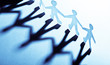 Paper people in teamworking concept