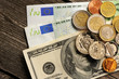 Photo: US and euro money over wooden background US and euro money over wooden background
