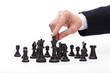 Photo: Business man moving chess figure Business man moving chess figure