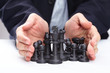 Photo: Business man moving chess figure Business man moving chess figure