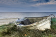 Old fishing boat on Sandy beach of the Baltic Sea