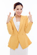 Young Asian business woman showing lucky sign