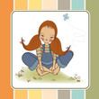 romantic girl sitting barefoot in the grass