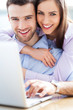 Couple using laptop