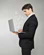 Business man with laptop and mail icon