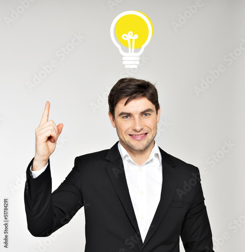 Photo: Business man with an idea bulb Business man with an idea bulb