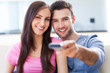 Couple with TV remote