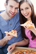 Couple eating pizza